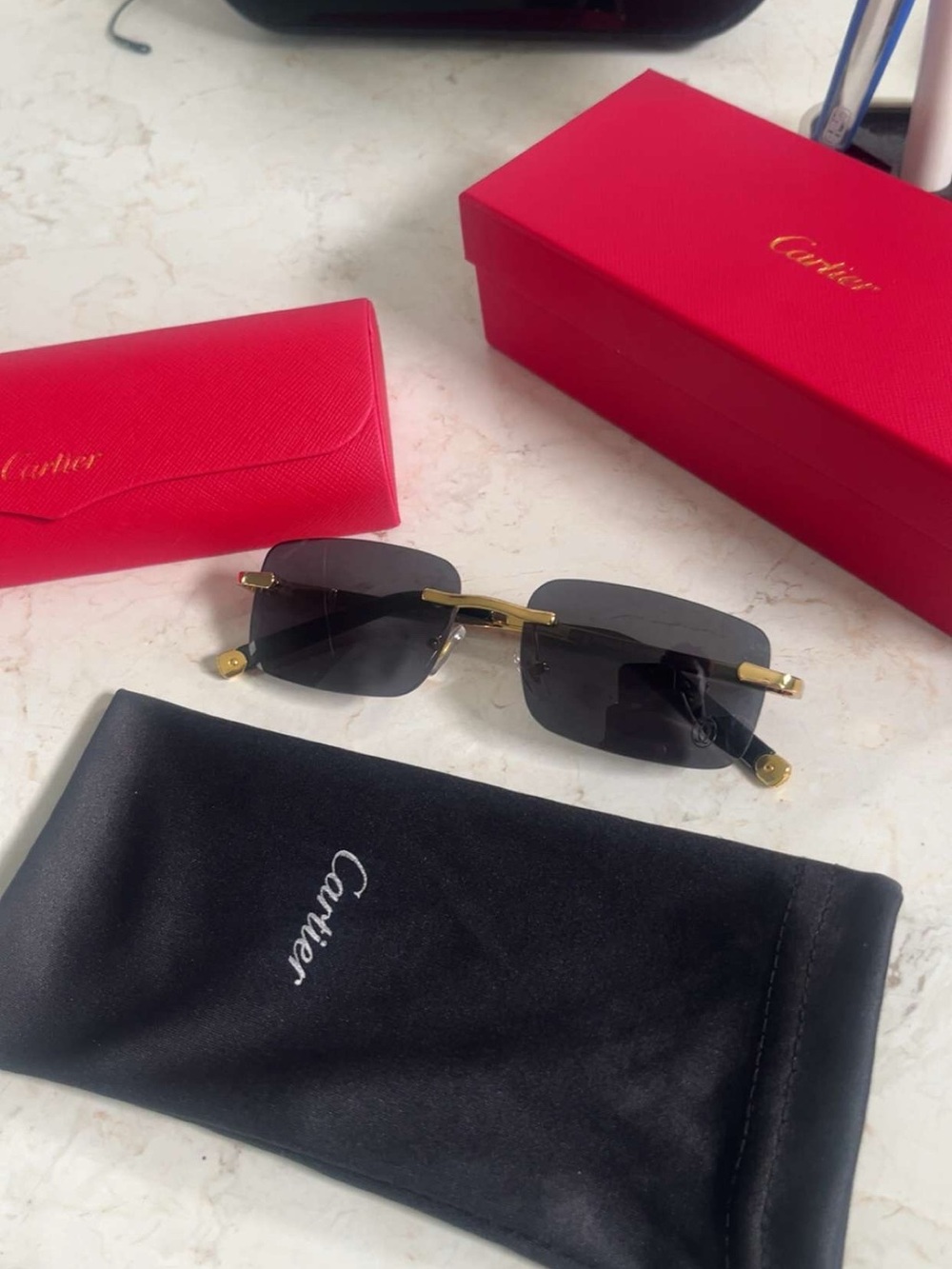 Cartier Black Lens Rimless Sunglasses with Gold Accents
